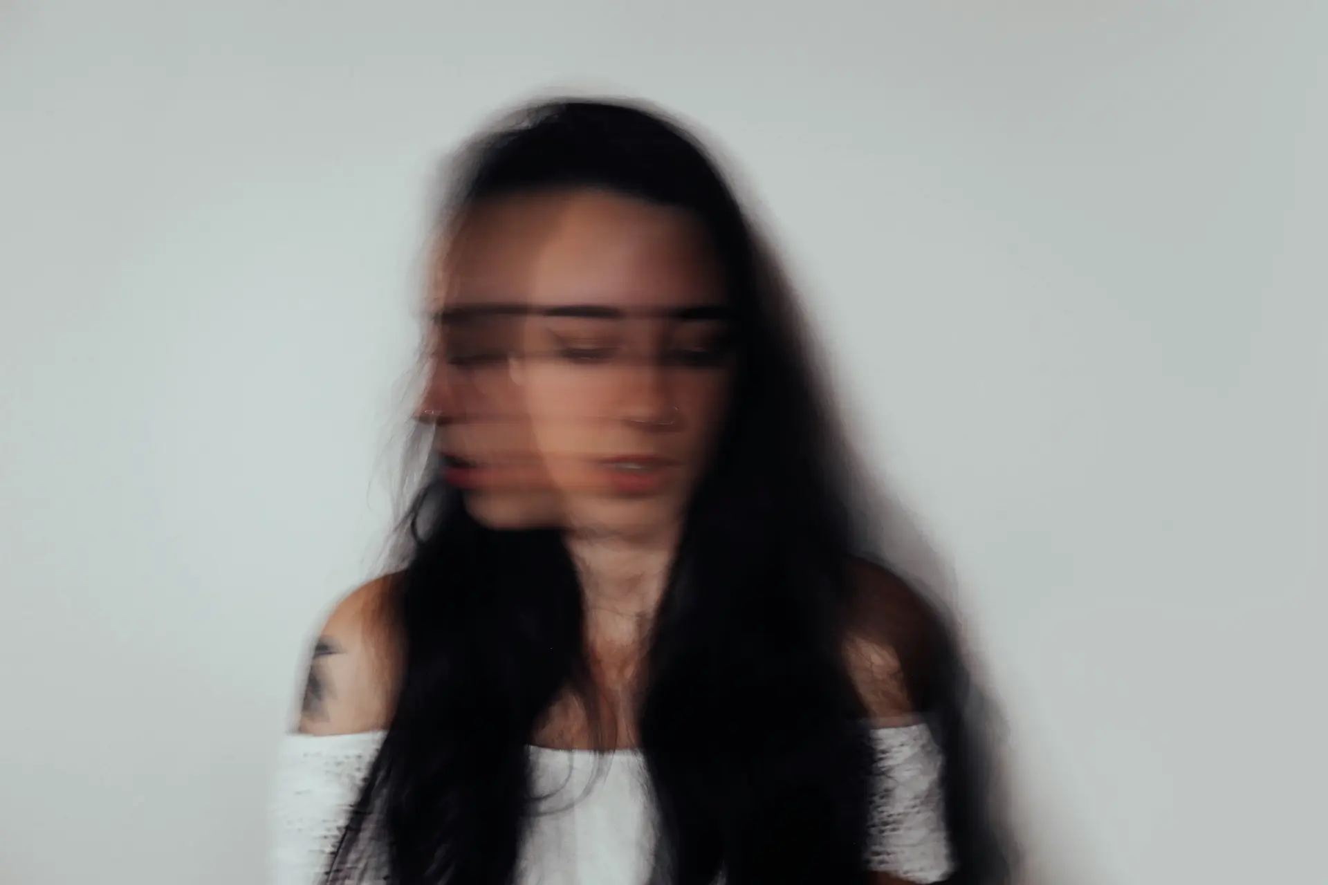 Woman whose face is blurry representing anxiety